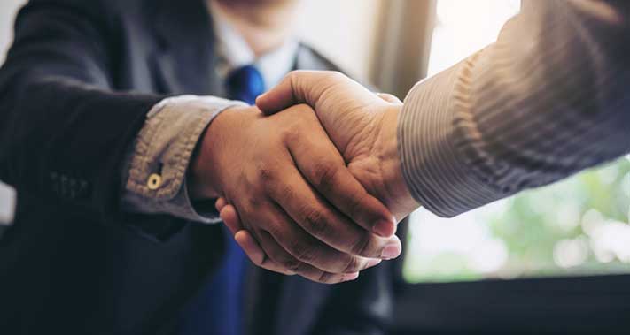 Attorney and client shaking hands